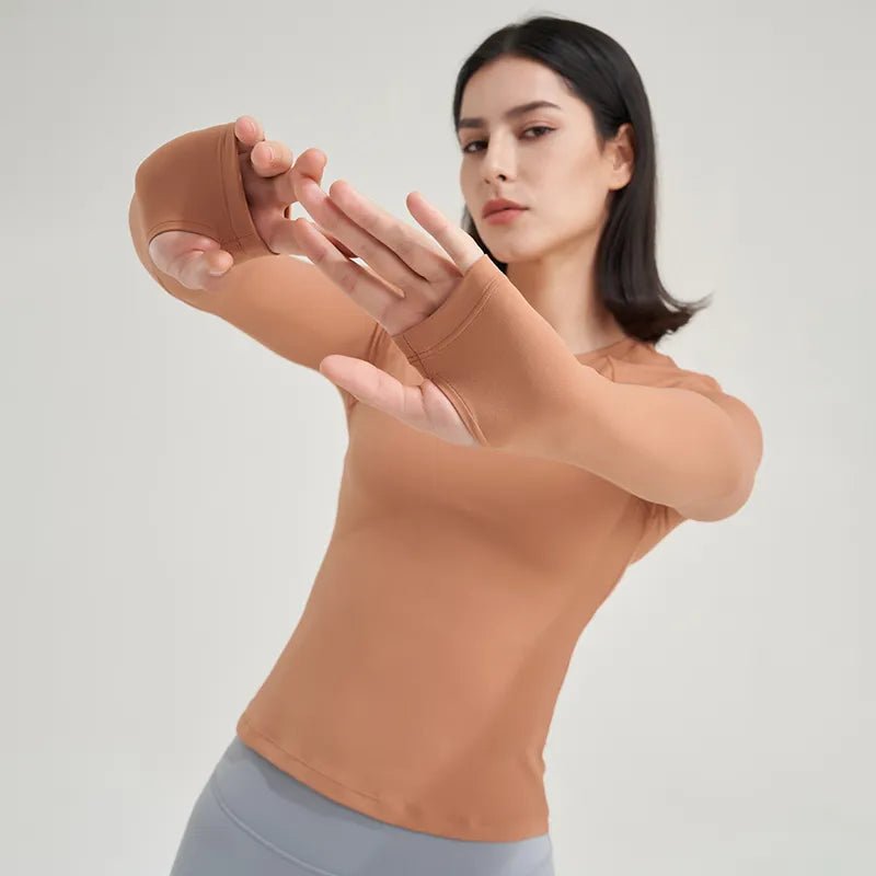 Women's yoga shirt designed for ultimate comfort and style. Made from high-quality, breathable, moisture-wicking fabric, it ensures flexibility and support for yoga and fitness sessions. Featuring a flattering design and vibrant colors, this versatile shirt keeps you cool, confident, and stylish during workouts - TNT Fitness Gear