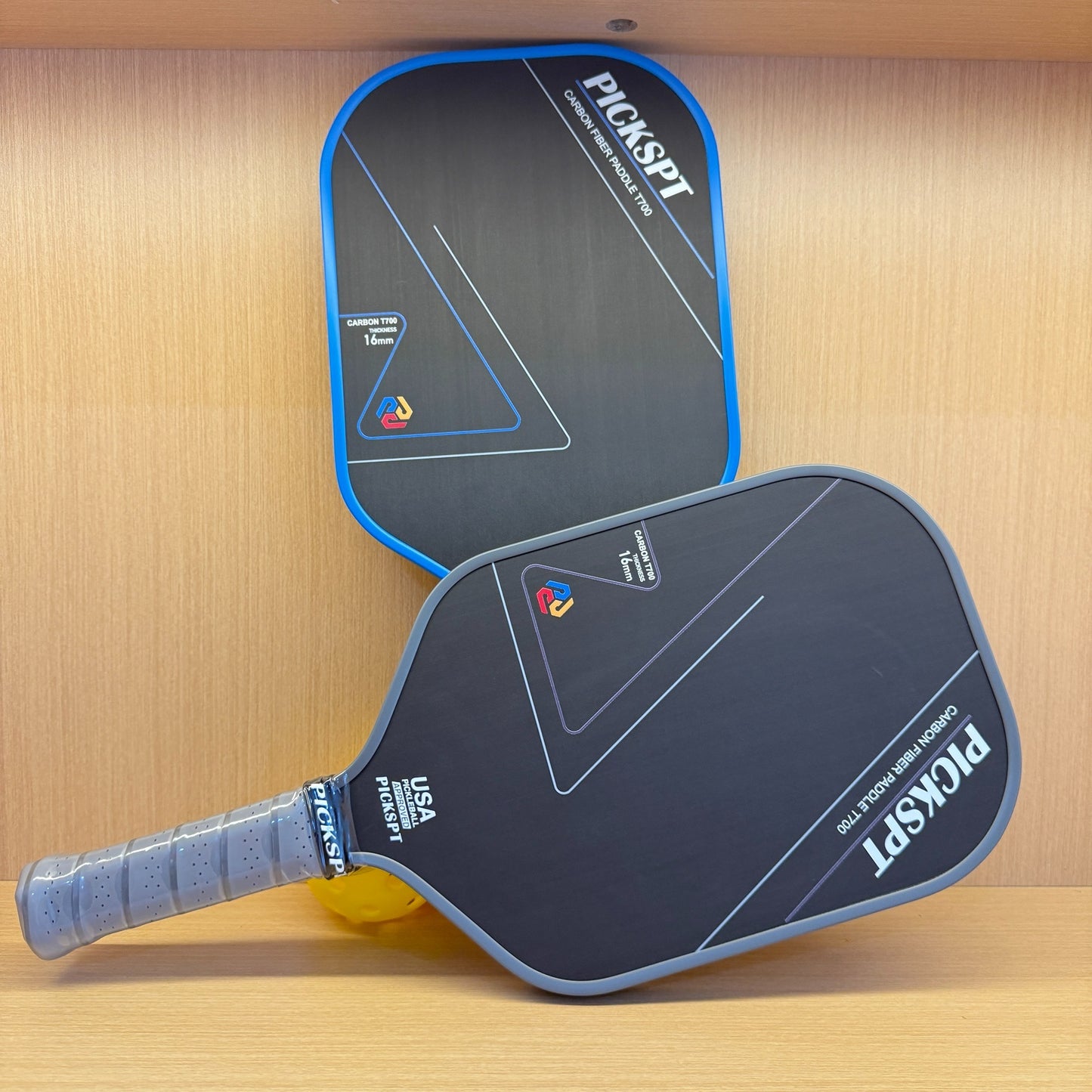 Professional pickleball paddle with carbon fiber face and ergonomic grip