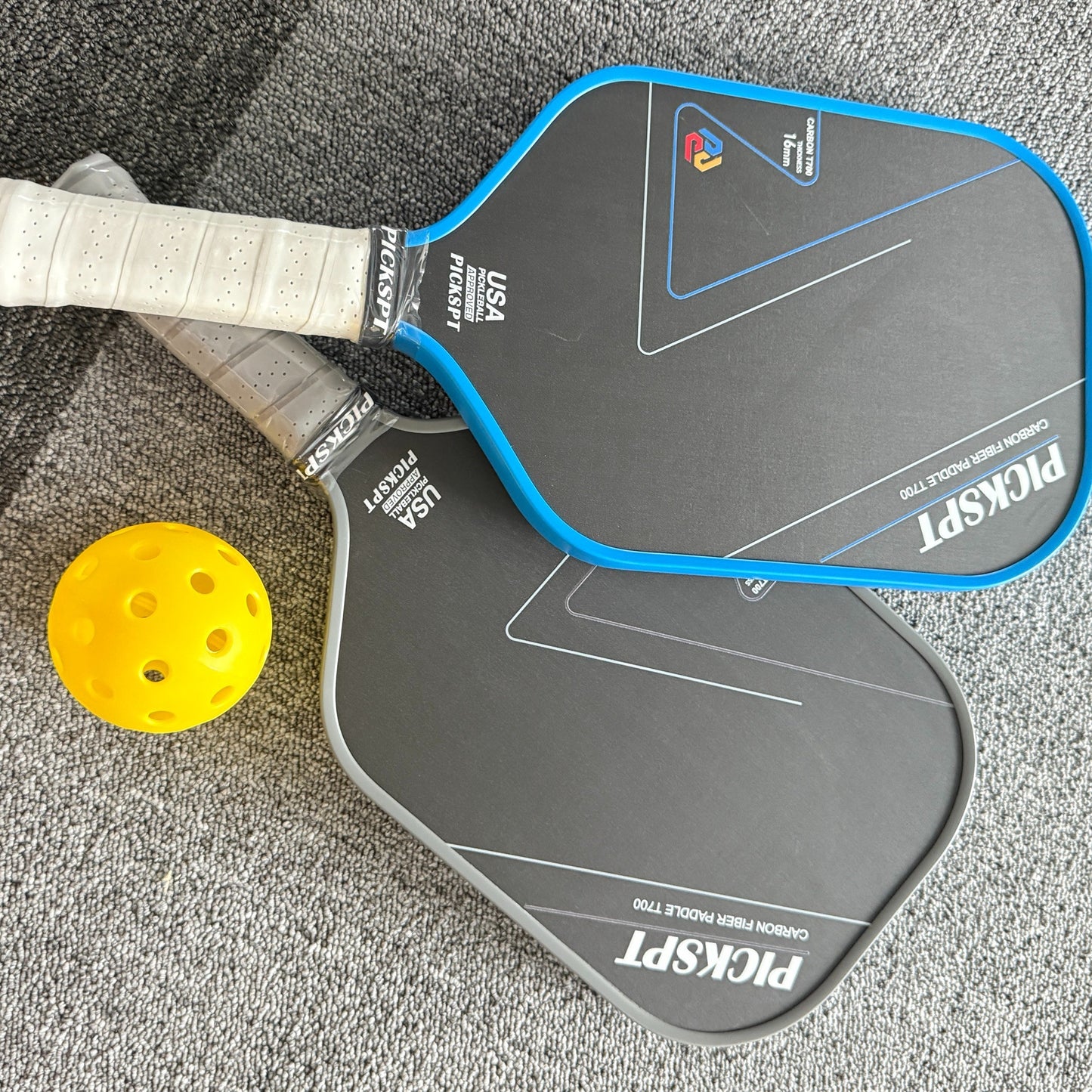 Professional pickleball paddle with carbon fiber face and ergonomic grip