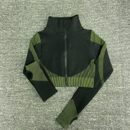 Green/ black women’s workout jacket flat lay