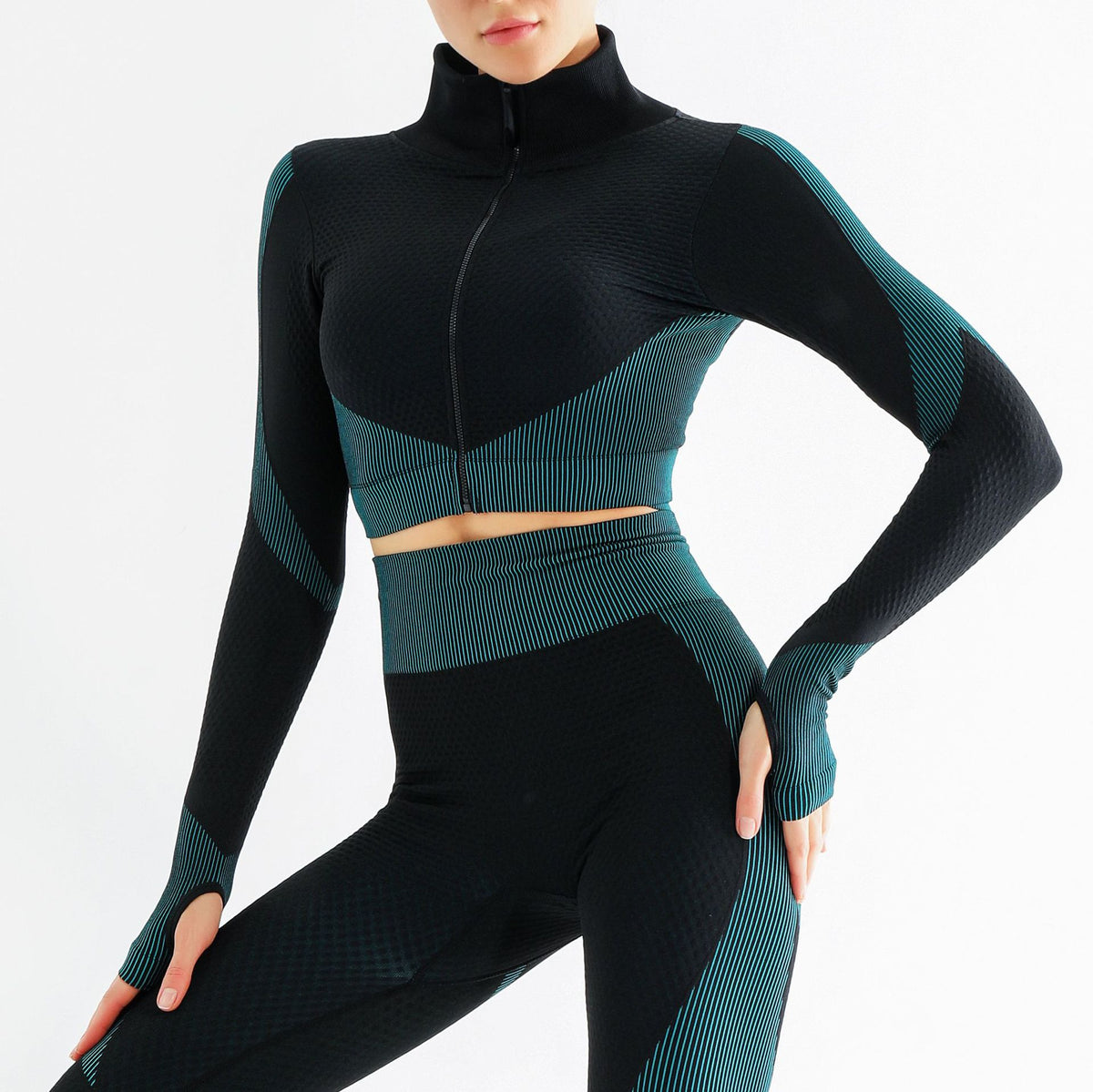 Woman wearing black matching gym set with long sleeve training top