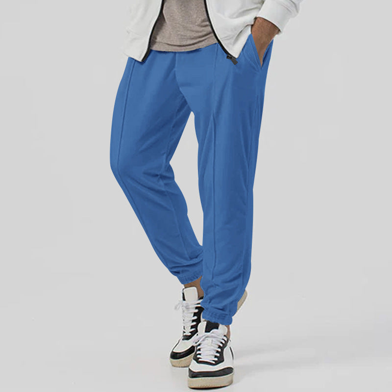 Men’s tapered casual joggers in blue, front view