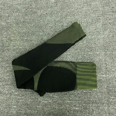 Black/green women’s high waisted workout leggings close-up