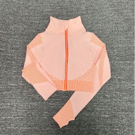 Pink women’s workout jacket flat lay