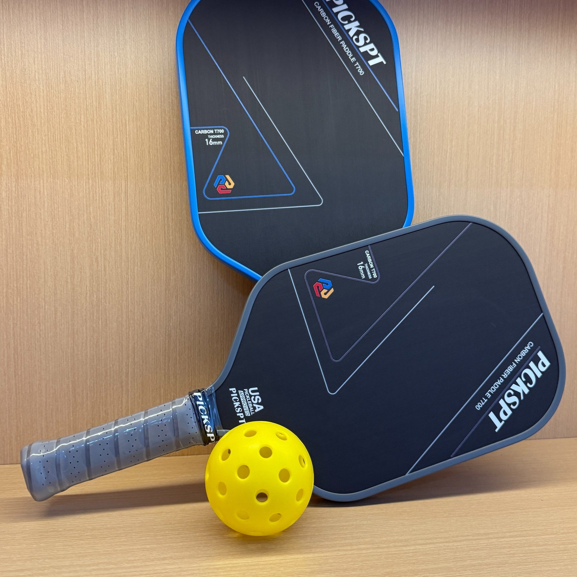 Professional pickleball paddle with carbon fiber face and ergonomic grip