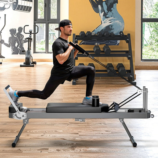 Man using a Pilates reformer machine in a home gym setting - TNT Fitness Gear