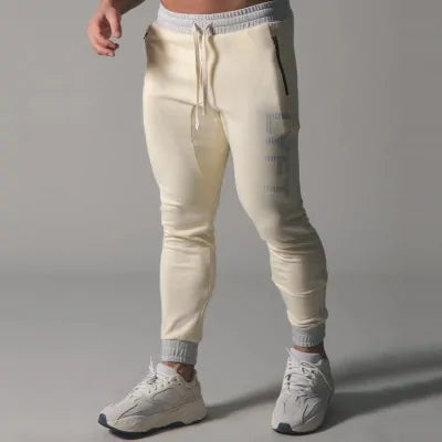 Men's Fitness Sweatpants - lightweight, breathable joggers with elastic waistband for comfort and tapered legs for a sleek look. Features moisture-wicking fabric and side pockets for essentials. Perfect for workouts or lounging. Available in stylish colors - TNT Fitness Gear