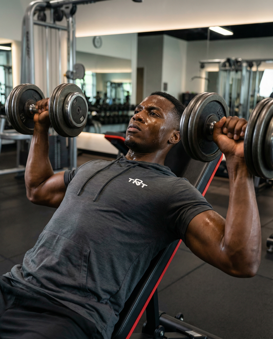 A man lifting weights on the adjustable dumbbell workout bench for home gym strength training from 
TNT Fitness Gear 