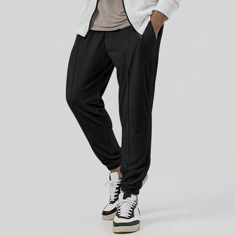 Men’s tapered casual joggers in black, rear view