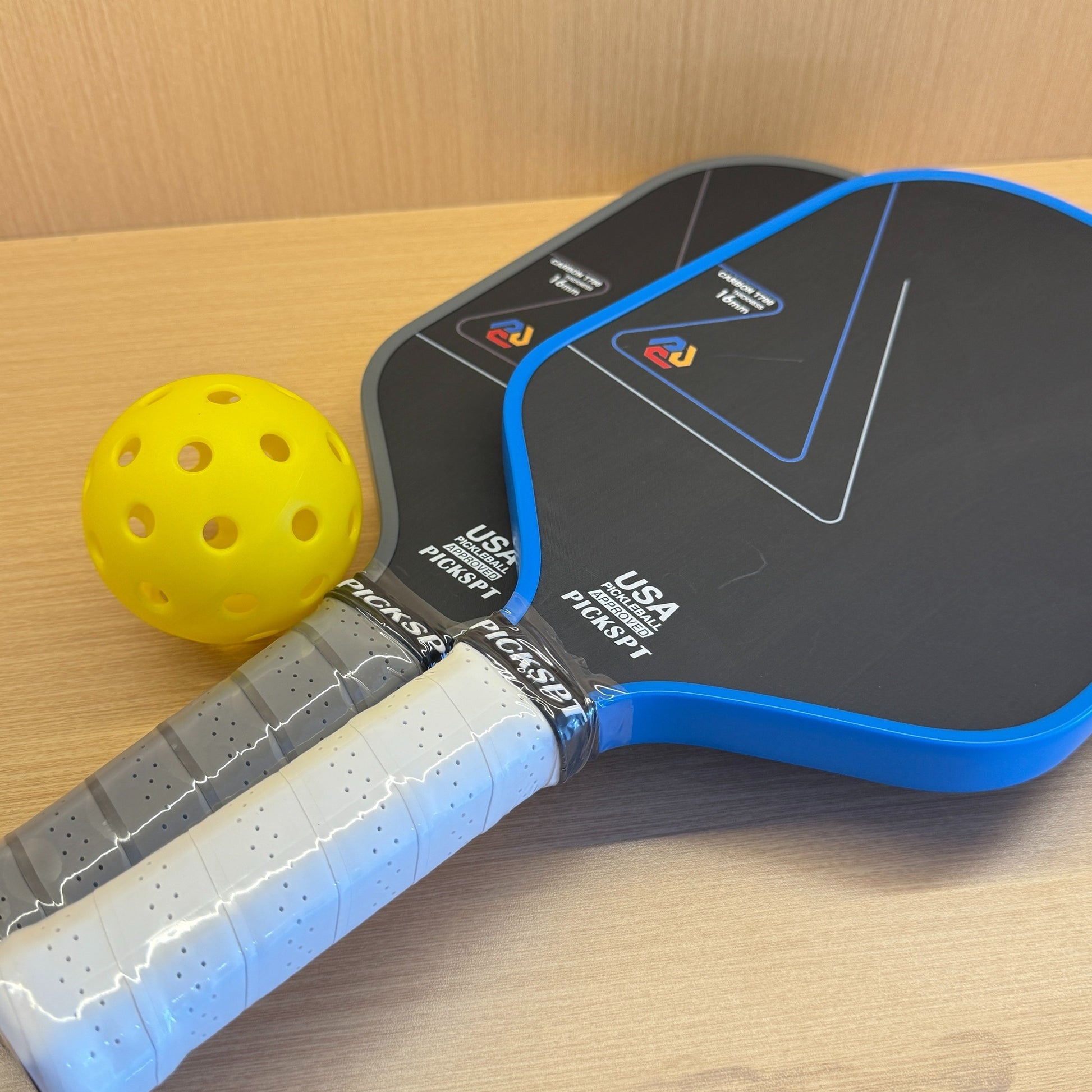 Professional pickleball paddle with carbon fiber face and ergonomic grip
