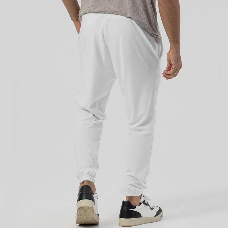 Men’s tapered casual joggers in white, rear view
