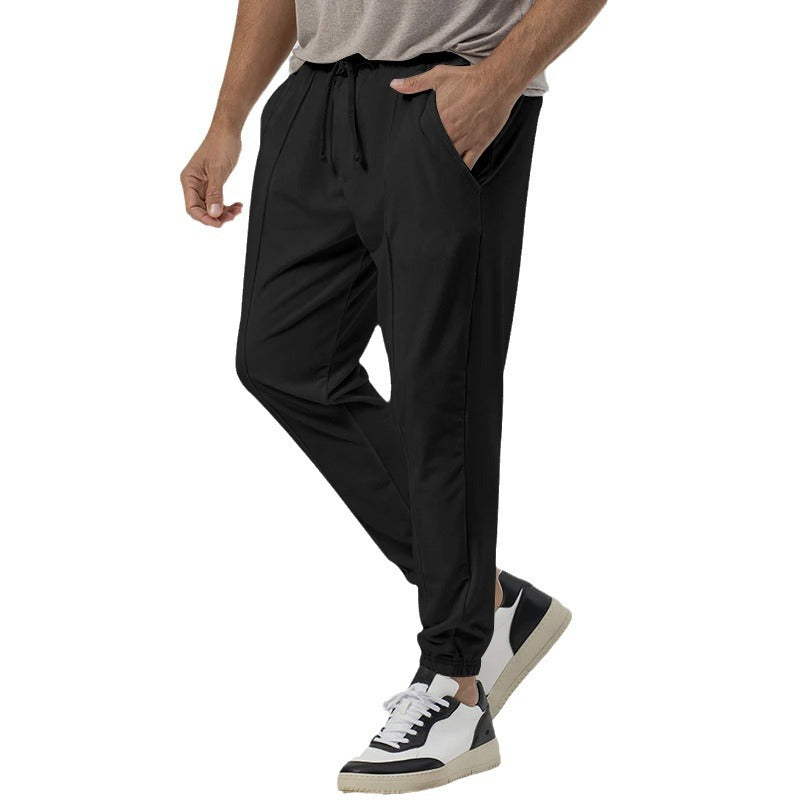Men’s tapered casual joggers in black, front view