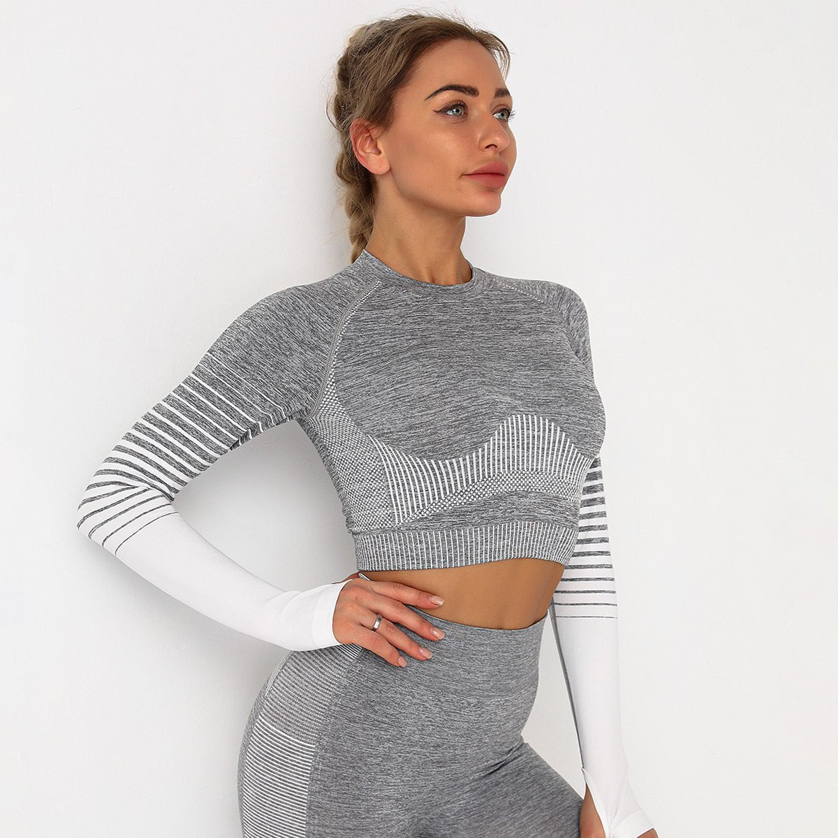Women wearing a seamless long sleeve training set designed for workouts and active movement.