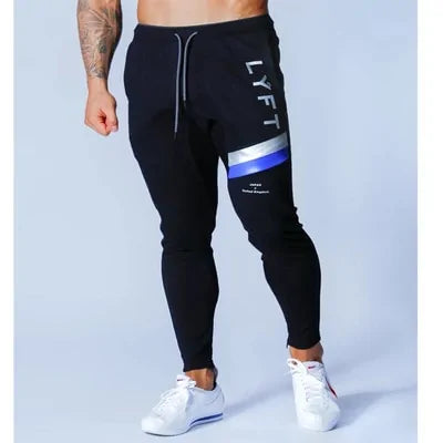 Men's Fitness Sweatpants - lightweight, breathable joggers with elastic waistband for comfort and tapered legs for a sleek look. Features moisture-wicking fabric and side pockets for essentials. Perfect for workouts or lounging. Available in stylish colors - TNT Fitness Gear
