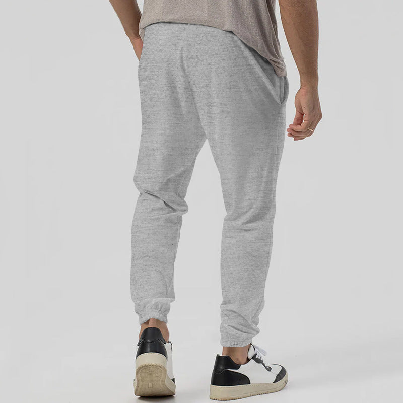 Men’s tapered casual joggers in gray, rear view
