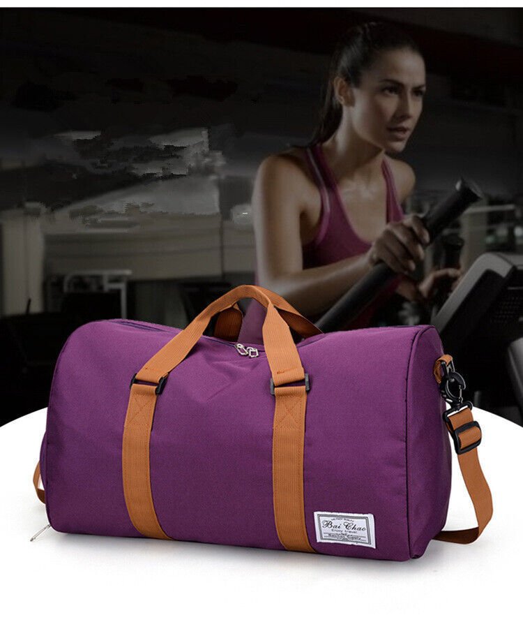 A durable and stylish large canvas training and travel bag with spacious compartments, breathable shoe pocket, and adjustable cushioned shoulder strap for convenience and versatility  - TNT Fitness Gear