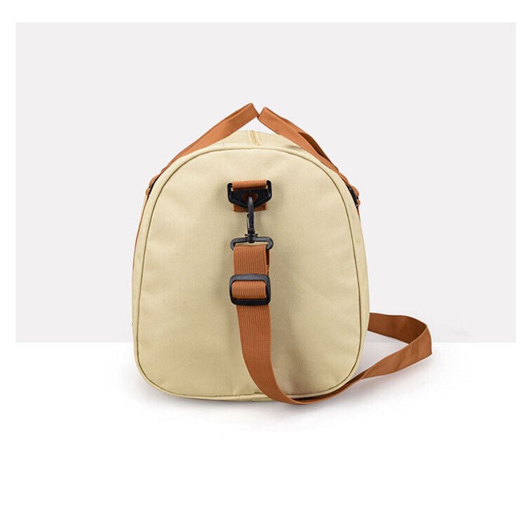 A durable and stylish large canvas training and travel bag with spacious compartments, breathable shoe pocket, and adjustable cushioned shoulder strap for convenience and versatility  - TNT Fitness Gear