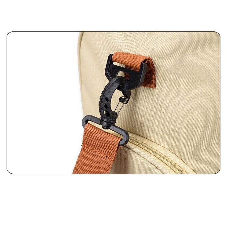 A durable and stylish large canvas training and travel bag with spacious compartments, breathable shoe pocket, and adjustable cushioned shoulder strap for convenience and versatility  - TNT Fitness Gear