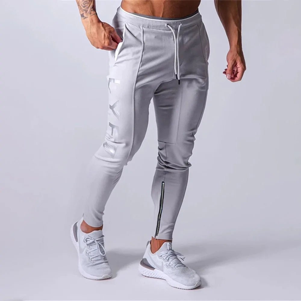 Men's Fitness Sweatpants - lightweight, breathable joggers with elastic waistband for comfort and tapered legs for a sleek look. Features moisture-wicking fabric and side pockets for essentials. Perfect for workouts or lounging. Available in stylish colors - TNT Fitness Gear