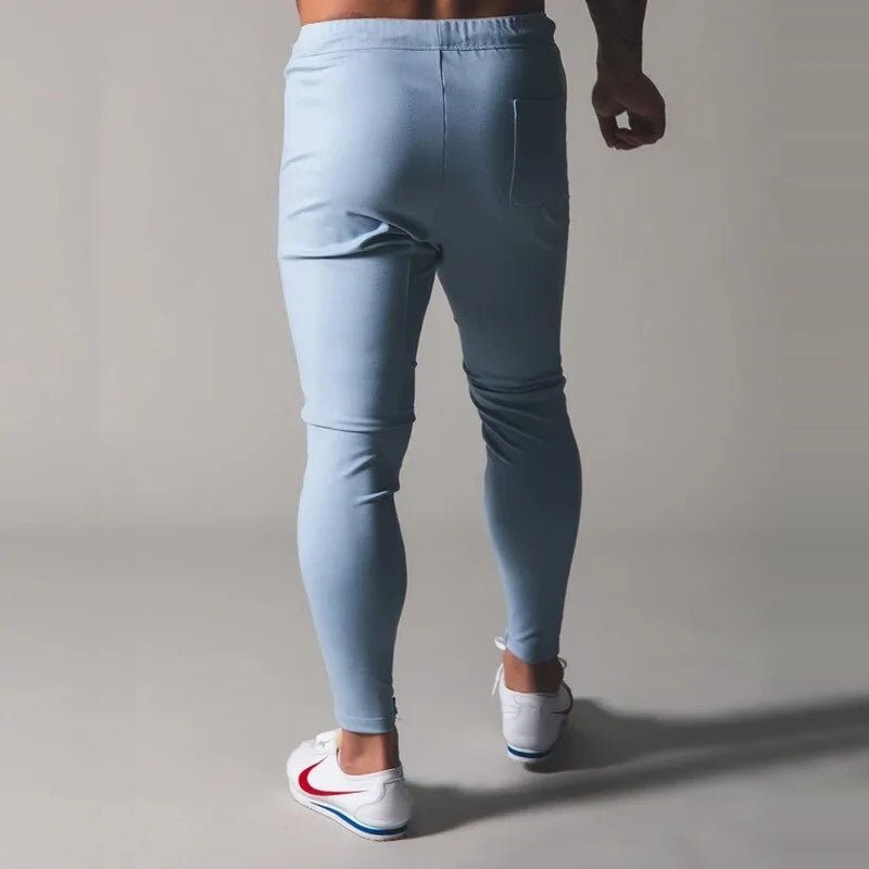 Men's Fitness Sweatpants - lightweight, breathable joggers with elastic waistband for comfort and tapered legs for a sleek look. Features moisture-wicking fabric and side pockets for essentials. Perfect for workouts or lounging. Available in stylish colors - TNT Fitness Gear