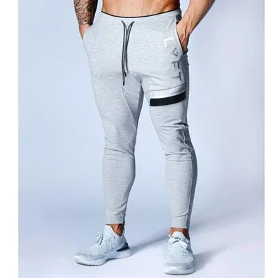 Men's Fitness Sweatpants - lightweight, breathable joggers with elastic waistband for comfort and tapered legs for a sleek look. Features moisture-wicking fabric and side pockets for essentials. Perfect for workouts or lounging. Available in stylish colors - TNT Fitness Gear