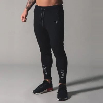 Men's Fitness Sweatpants - lightweight, breathable joggers with elastic waistband for comfort and tapered legs for a sleek look. Features moisture-wicking fabric and side pockets for essentials. Perfect for workouts or lounging. Available in stylish colors - TNT Fitness Gear