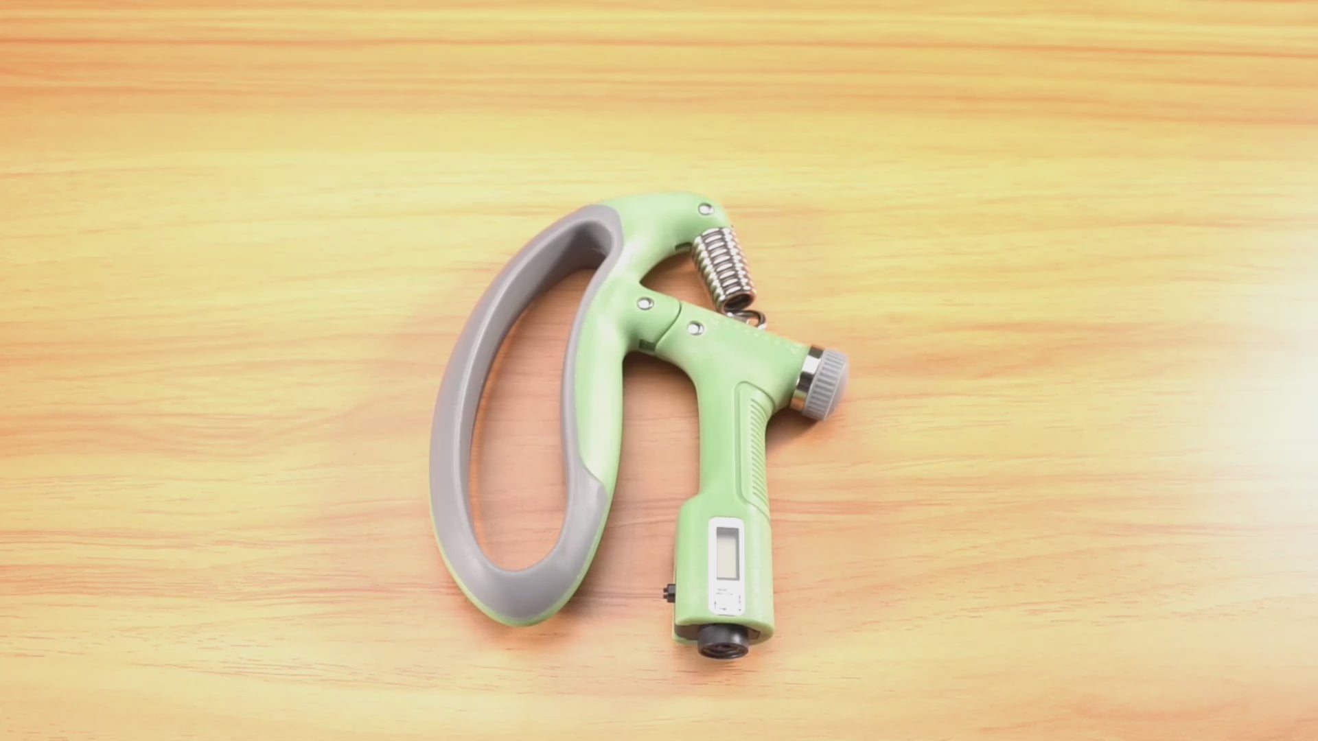 Demonstration video of the Adjustable Hand Grip Strength Trainer in use, showcasing adjustable resistance levels and built-in counter. Highlights its effectiveness in improving grip strength and forearm endurance for all fitness levels -TNT Fitness Gear