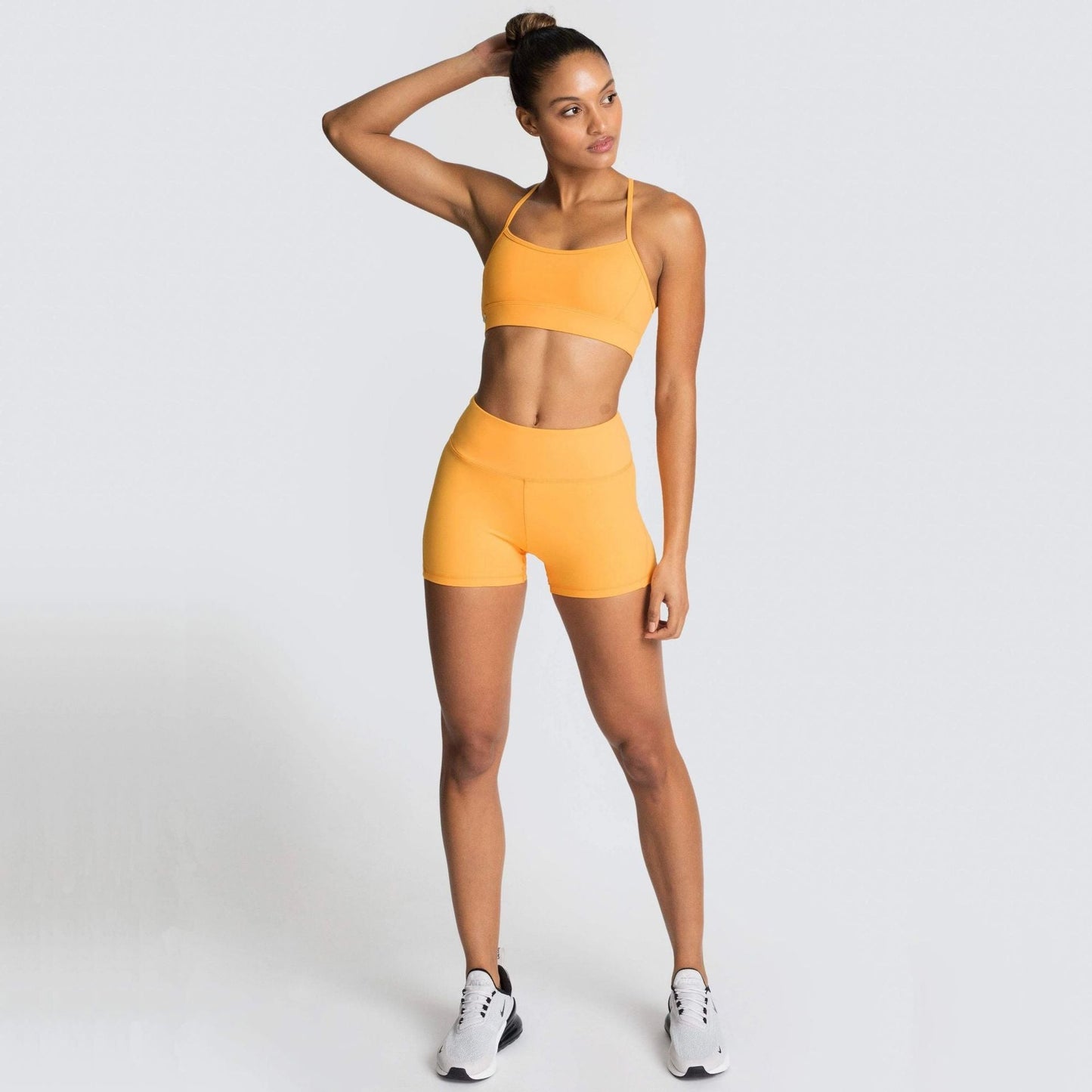 Women wearing a lightweight training shorts set designed for gym workouts and active movement