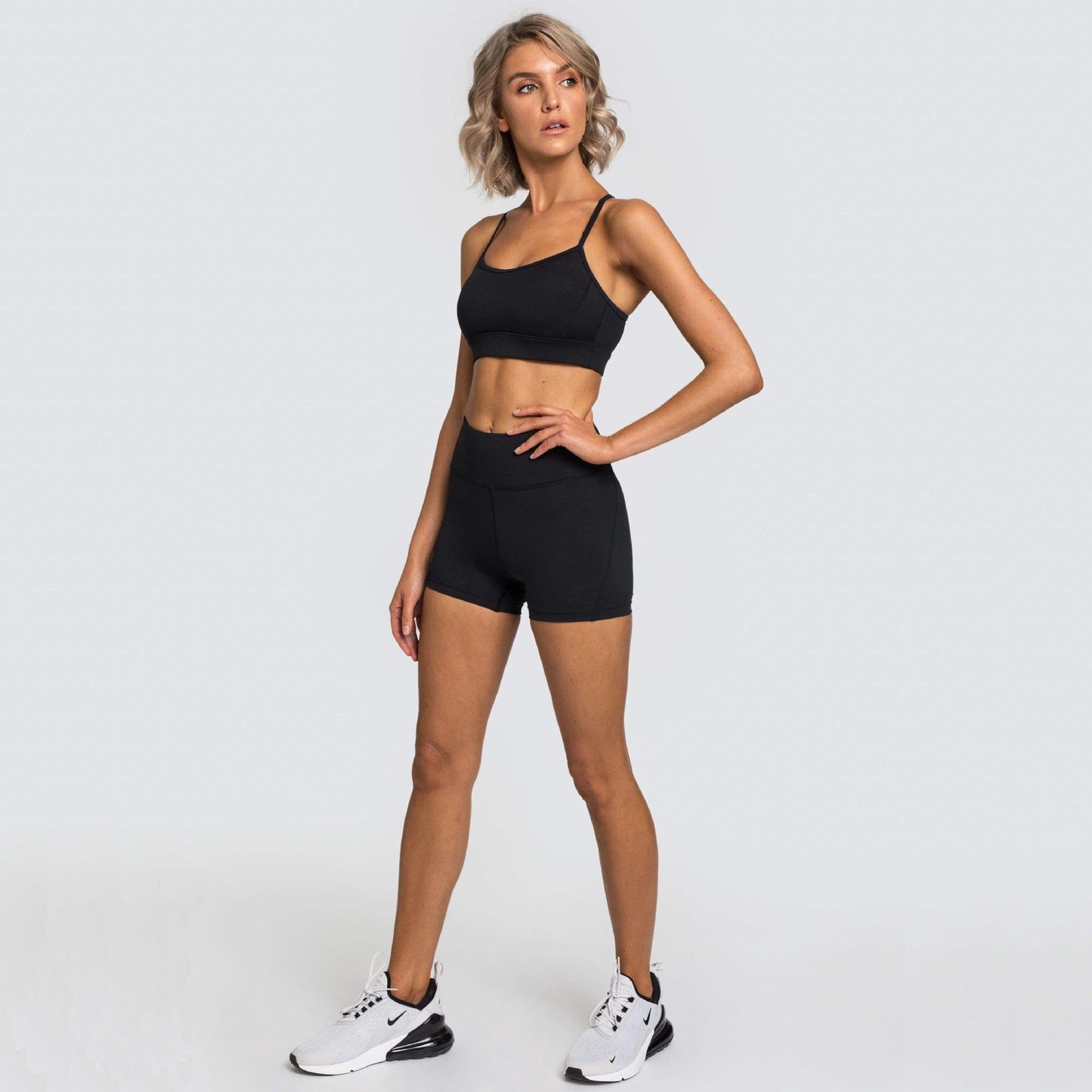 Women wearing a lightweight training shorts set designed for gym workouts and active movement