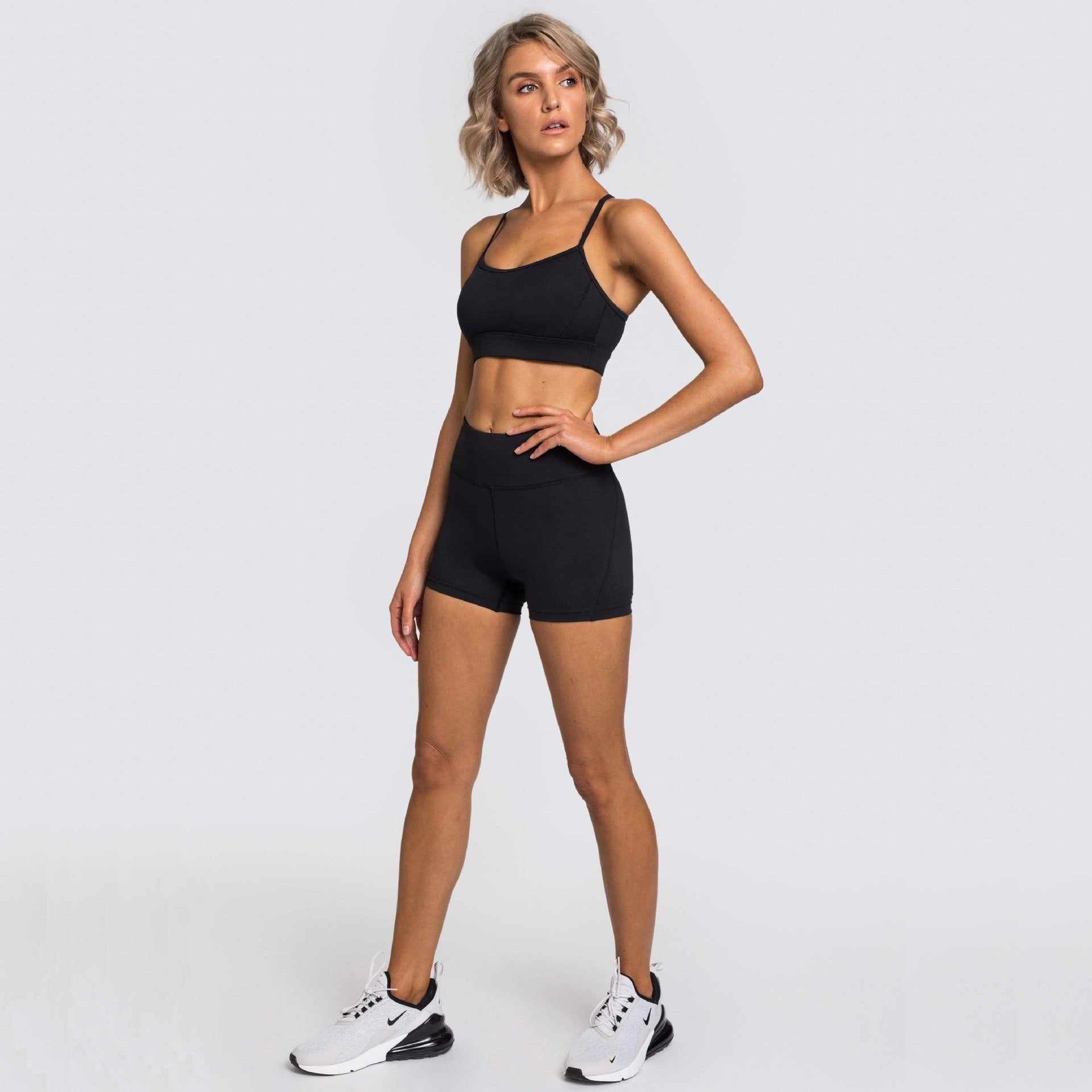 Women wearing a lightweight training shorts set designed for gym workouts and active movement