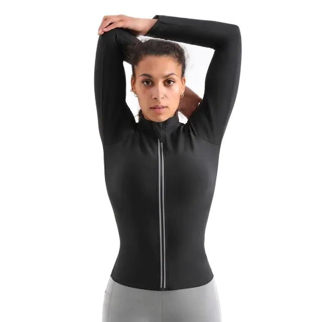 Woman wearing a long-sleeve thermal training zip vest during workout session