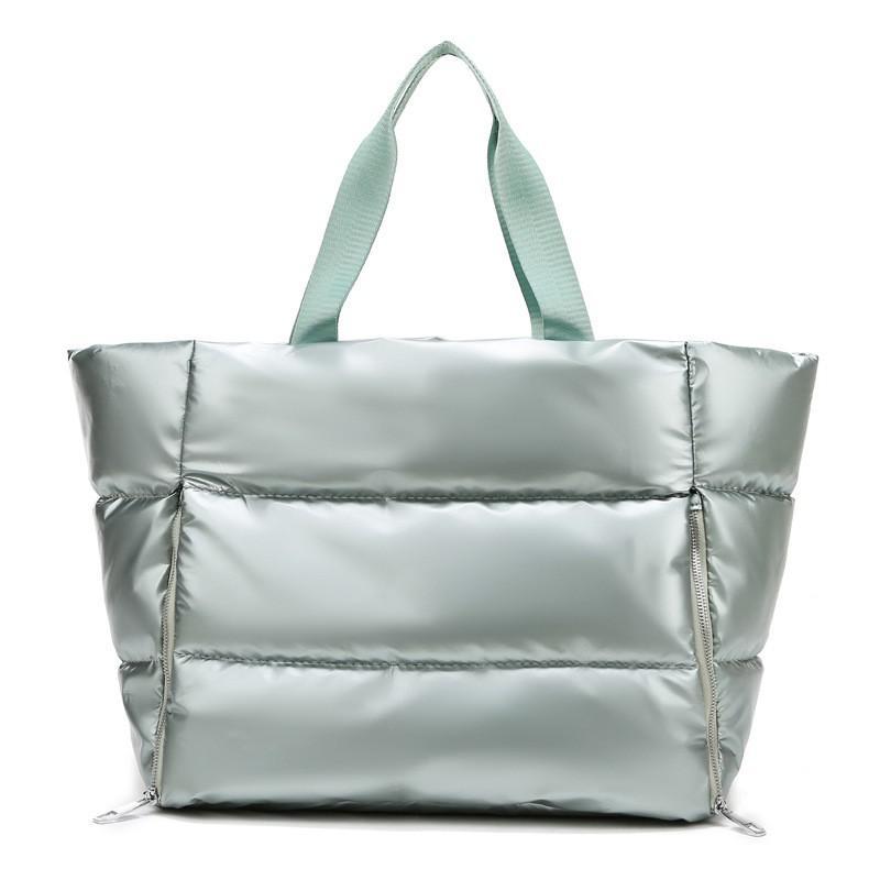 Chic and durable women's training bag made of waterproof nylon, featuring multiple compartments and versatile carrying options for the modern woman on the go – TNT Fitness Gear