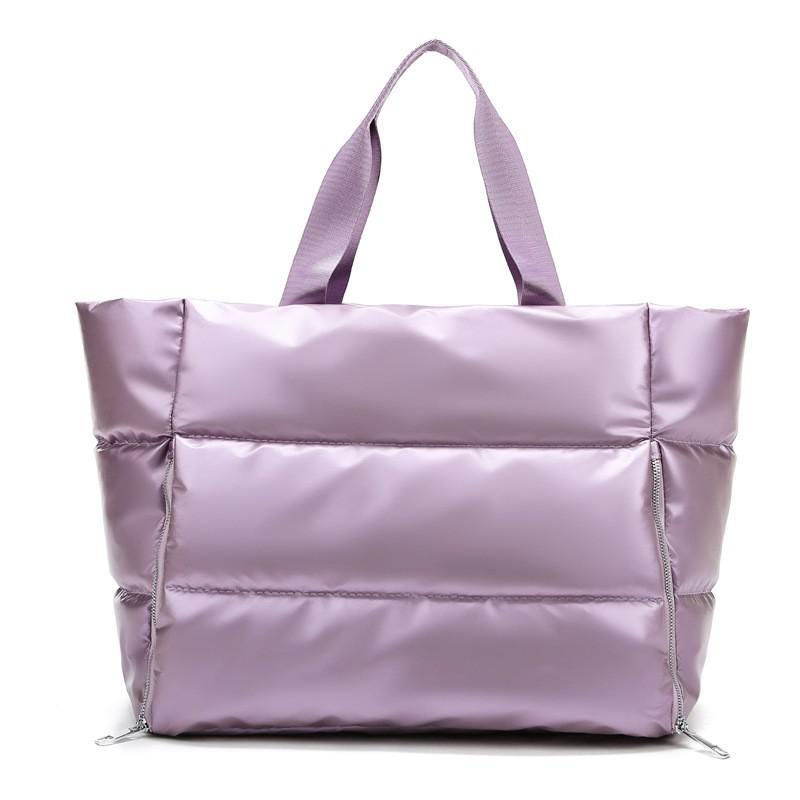 Chic and durable women's training bag made of waterproof nylon, featuring multiple compartments and versatile carrying options for the modern woman on the go – TNT Fitness Gear